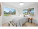 Bright bedroom featuring windows and neutral decor at 105 12Th Sw St, Ruskin, FL 33570