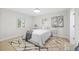 Cozy bedroom featuring a plush rug, neutral colors, and plenty of natural light at 105 12Th Sw St, Ruskin, FL 33570