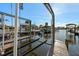View of the boat lift and private dock at 105 12Th Sw St, Ruskin, FL 33570