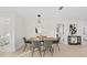 A modern dining room with decorative light fixture at 105 12Th Sw St, Ruskin, FL 33570
