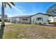 Inviting home with blue shutters, a well-manicured lawn, and fresh, modern landscaping at 105 12Th Sw St, Ruskin, FL 33570