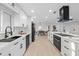 A modern kitchen with white cabinets and stainless steel appliances at 105 12Th Sw St, Ruskin, FL 33570