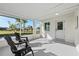 Inviting screened porch featuring neutral flooring, white brick walls, and serene outdoor views at 105 12Th Sw St, Ruskin, FL 33570