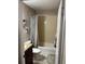 Bathroom with tiled shower and granite countertop vanity at 1317 W Alicia Ave, Tampa, FL 33604