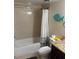 Full bathroom with tiled walls, a shower-tub combo, and a stylish vanity for a functional layout at 1317 W Alicia Ave, Tampa, FL 33604