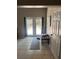 Entryway featuring French doors, neutral tile, and view of the outdoors at 1317 W Alicia Ave, Tampa, FL 33604