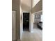Hallway showcasing an open floor plan with a view into a separate office or bedroom at 1317 W Alicia Ave, Tampa, FL 33604