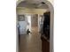 Kitchen view from archway with tile floors and stainless steel appliances at 1317 W Alicia Ave, Tampa, FL 33604