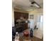 Galley kitchen with dark wood cabinets, stainless appliances, and direct views to other rooms at 1317 W Alicia Ave, Tampa, FL 33604