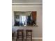 Kitchen passthrough with breakfast bar and stools with direct view to the yard at 1317 W Alicia Ave, Tampa, FL 33604