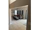 Cozy living room with gray sofa, large windows, and tiled floors at 1317 W Alicia Ave, Tampa, FL 33604