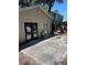 Outdoor patio area with seating, perfect for relaxing and entertaining guests, surrounded by greenery at 1317 W Alicia Ave, Tampa, FL 33604