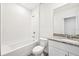Clean bathroom featuring a tub with shower, toilet, granite vanity, and tiled floors at 14005 Crutchfield Ct, Parrish, FL 34219