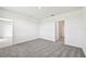 Cozy bedroom with plush carpeting, access to another room, and a view of the interior at 14005 Crutchfield Ct, Parrish, FL 34219