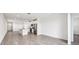 Spacious living area with tile floors, connecting the entryway and kitchen in an open layout at 14005 Crutchfield Ct, Parrish, FL 34219