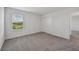This is a bedroom featuring neutral walls, comfortable carpeting, and lots of natural light from the window at 14076 Crutchfield Ct, Parrish, FL 34219
