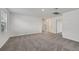 A bright bedroom featuring neutral walls, plush carpet, and lots of natural light from a large window at 14076 Crutchfield Ct, Parrish, FL 34219
