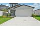Charming home featuring a well-manicured lawn and a two-car garage at 14076 Crutchfield Ct, Parrish, FL 34219