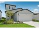 Beautiful curb appeal with a well-maintained lawn and a two-car garage at 14076 Crutchfield Ct, Parrish, FL 34219