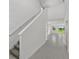 Hallway with natural light and tile floors that lead to a bright living space at 14076 Crutchfield Ct, Parrish, FL 34219