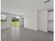 Bright living room with tile flooring, sliding glass doors, and backyard views at 14076 Crutchfield Ct, Parrish, FL 34219