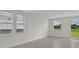 The living room has two windows and a sliding door with a backyard view at 14076 Crutchfield Ct, Parrish, FL 34219