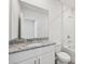 Bathroom features a combination tub and shower unit, a white toilet, and a vanity at 14115 Crutchfield Ct, Parrish, FL 34219