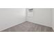Well-lit bedroom featuring neutral walls, carpet, and a window at 14115 Crutchfield Ct, Parrish, FL 34219