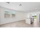 Modern kitchen featuring stainless steel appliances, tile floors, and an island with sink at 14115 Crutchfield Ct, Parrish, FL 34219