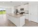 Bright kitchen with large island, stainless steel appliances, and an open layout at 14115 Crutchfield Ct, Parrish, FL 34219