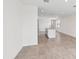 Open-concept kitchen with tile flooring, stainless steel appliances, and center island with sink at 14115 Crutchfield Ct, Parrish, FL 34219