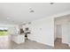 Bright, open kitchen with stainless steel appliances, white cabinetry, and ample counter space at 14115 Crutchfield Ct, Parrish, FL 34219