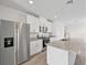Modern kitchen with stainless steel appliances, granite countertops, and ample cabinet space at 14115 Crutchfield Ct, Parrish, FL 34219