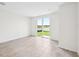 Bright living area with sliding glass doors providing scenic backyard view and access to the outdoors at 14115 Crutchfield Ct, Parrish, FL 34219