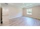 Bright bedroom with light wood floors, recessed lighting, and a large window at 2277 Broadpoint Dr, Punta Gorda, FL 33983