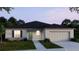 Charming single-story home with well-manicured lawn and neutral color palette at 2277 Broadpoint Dr, Punta Gorda, FL 33983