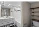 Contemporary bathroom with stylish vanity, tiled tub, and modern shelving at 2411 W Horatio St # 537, Tampa, FL 33609