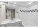 Bathroom featuring a modern vanity, a large mirror, and tiled shower and tub at 2411 W Horatio St # 537, Tampa, FL 33609