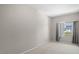 Bedroom featuring neutral walls, carpeted floor, and a window with natural light at 2411 W Horatio St # 537, Tampa, FL 33609