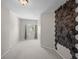 Bedroom with modern geometric accent wall, neutral carpet, and a sunlit window at 2411 W Horatio St # 537, Tampa, FL 33609