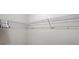 Walk-in closet featuring white wire shelving for ample storage and organization at 2411 W Horatio St # 537, Tampa, FL 33609