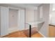 Kitchen with bar area leading to an adjacent carpeted room through a pair of white doors at 2411 W Horatio St # 537, Tampa, FL 33609