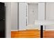 Open view from kitchen bar area into the adjacent room through a pair of white doors at 2411 W Horatio St # 537, Tampa, FL 33609