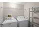 Bright laundry room with modern appliances and convenient shelving for storage at 2411 W Horatio St # 537, Tampa, FL 33609