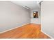 Open-concept living room with hardwood floors and a view into the kitchen at 2411 W Horatio St # 537, Tampa, FL 33609