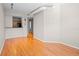 Spacious living room with warm-toned hardwood floors, modern lighting, and an open layout at 2411 W Horatio St # 537, Tampa, FL 33609