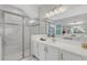 Double vanity, quartz countertop, updated fixtures, soaking tub, and a glass enclosed shower at 32740 Tree Of Life Ave, Wesley Chapel, FL 33543