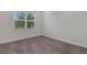 Empty bedroom with a window showing the outside at 32740 Tree Of Life Ave, Wesley Chapel, FL 33543