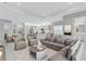 Open-concept living area seamlessly connects the kitchen, living, and dining spaces at 32740 Tree Of Life Ave, Wesley Chapel, FL 33543