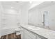 Bright bathroom features a shower-tub combo and granite countertop vanity with white cabinets at 4249 Banjo Lake Rd, Land O Lakes, FL 34639